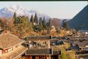 View over Lijiang with stunning mountains beyond.